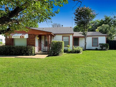 Single story home with a front lawn
