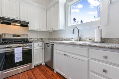 Kitchen with new gas range, dishwasher, refrigerat
