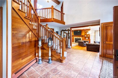 Foyer view opening to gorgeous living room.