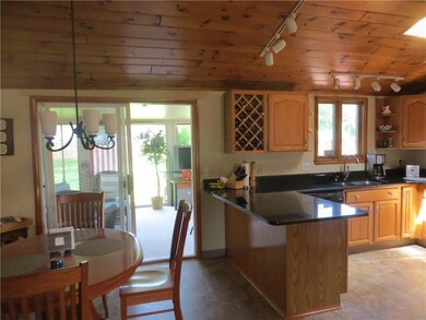 Kitchen & Dining Area opens to enclosed Sun room.