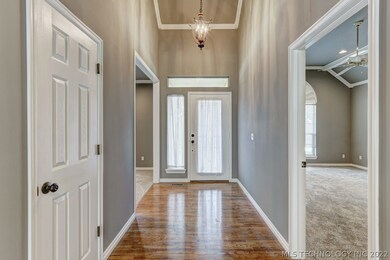 Inviting foyer gets beautiful natural light; high