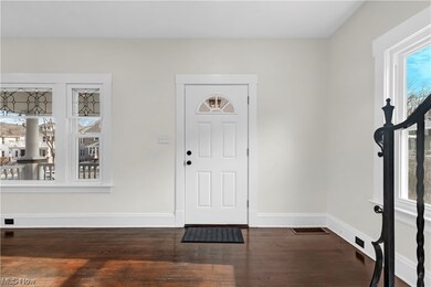 Foyer with dark hardwood / wood-style floors