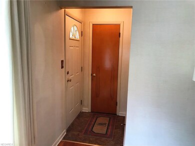 Entry foyer with guest closet and nice front door.