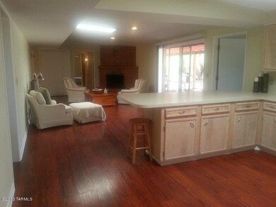 Kitchen and siting area with fireplace