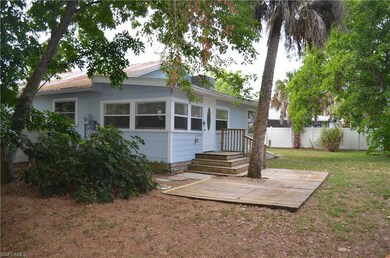 Back of house featuring a lawn