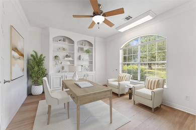 Home office with custom built-ins.  Virtually staged