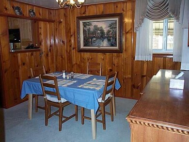 Dining Room. Welcome your friends or family into this warm setting for those holiday dinners.