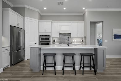 Well appointed kitchen features soft touch 