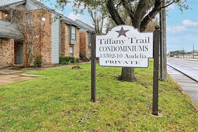Community / neighborhood sign with a lawn