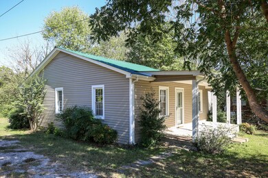New vinyl siding and tin roof.  