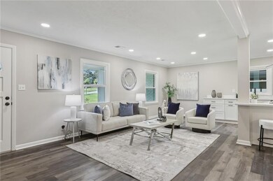 Living area with ornamental molding, dark wood-sty