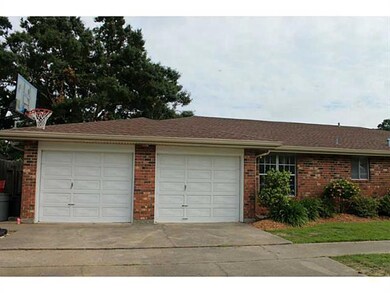 Exterior Back. Double garage doors are always a pl