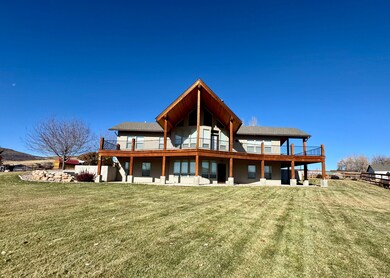 Back of house featuring a patio and a lawn