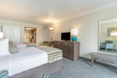 Bedroom featuring a chandelier, carpet floors, sta