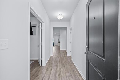 Hallway featuring light wood-type flooring
