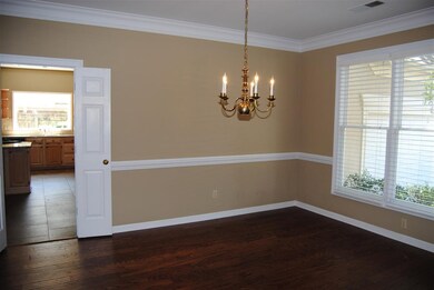 Spacious formal dining room located off entry.  Wo