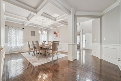 Dining area with plenty of natural light, dark woo