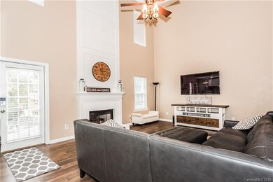 Great room with floor to ceiling decorative moulding above the gas fireplace!