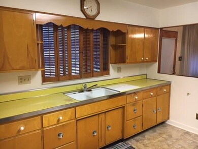 Eat-in-Kitchen with Wooden Cabinets and Pass Throu