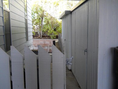 side of home pic of sheds