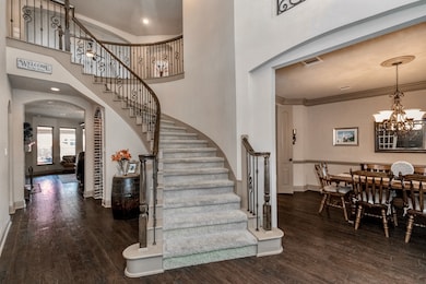 STEP INTO THE ENTRYWAY, FEATURING A BEAUTIFUL WIND