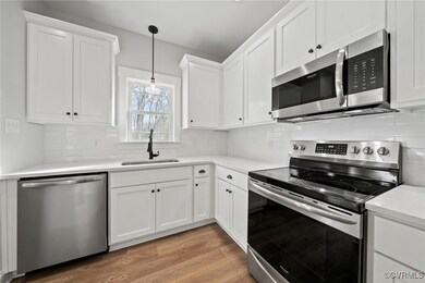 Custom cabinetry throughout with stainless applian