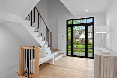 View looking to the front of the home showing the staircases to the upper and lower levels