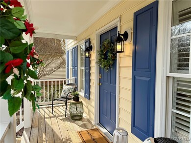 Property entrance featuring covered porch