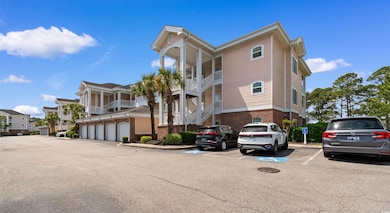 View of property with uncovered parking