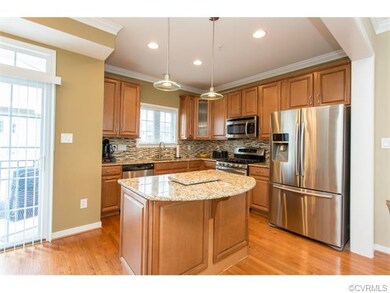Gourmet kitchen with custom back splash, granite c
