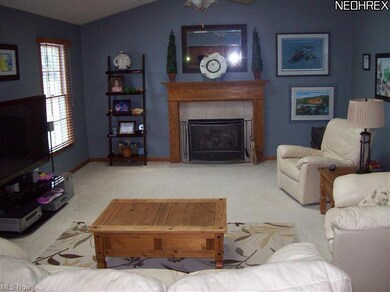 Kitchen opens to Vaulted Family Room with Gas Fire