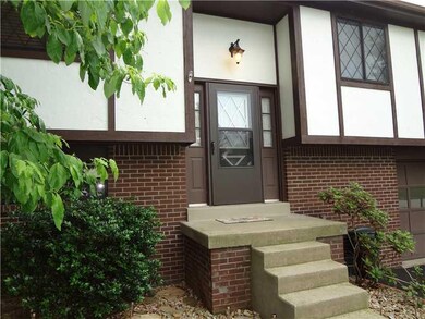 Exterior Front. Tudor-style design with the compli