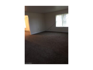 Living room at front of the house.  Front door lea