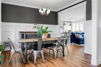 Open dining area with many moldings and luxury pla