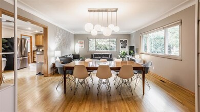 New hardwood floors in the great room, dining room and breakfast room. Check out the West Elm ceiling light ficture!