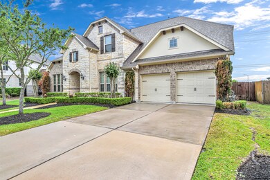Double-wide driveway to the spacious 3-car tandem garage with a garage door opener