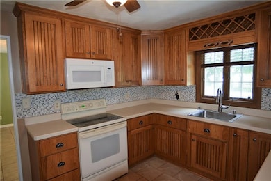 The kitchen features custom cabinetry and abundant