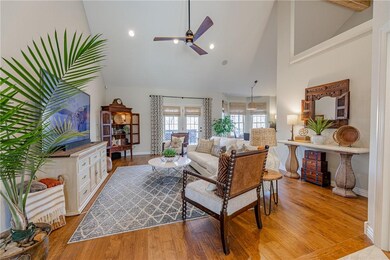 Living Room has cathedral ceilings and beautiful beam