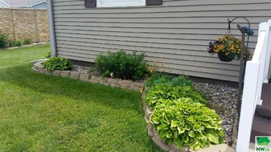 Rock beds in front yard - June