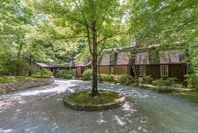 Stone walls, brick and clapboard siding, two car g