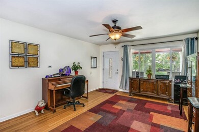 Note the pretty refinished hardwood floors and new