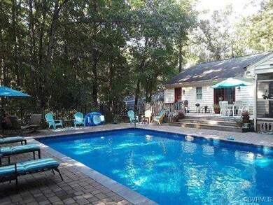 Pool with fence and a patio area