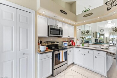 Kitchen featuring a chandelier, light tile pattern