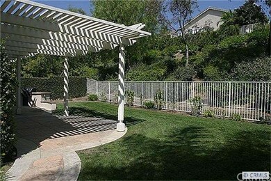 Nice sized yard with patio cover and built in BBQ