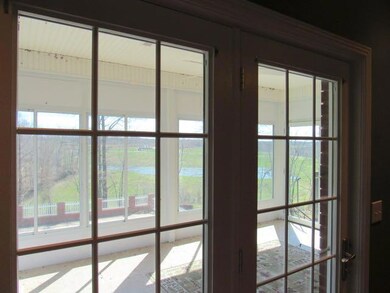French doors lead from the master bedroomonto a relaxing sun deck.  Note the view to the back!