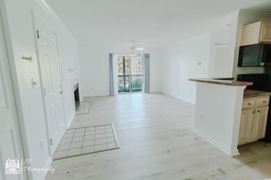 Unfurnished living room with light wood-style floo
