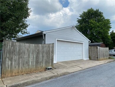 Oversized 2 car garage with workbench, storage and