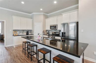 Kitchen featuring appliances with stainless steel