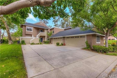 The community is nestled amongst mature trees, hil