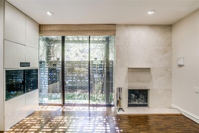 Wall of windows with sliding door leads to private